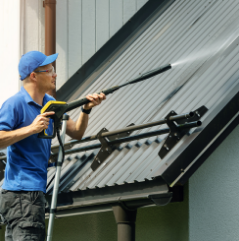 Professional roof cleaning in progress